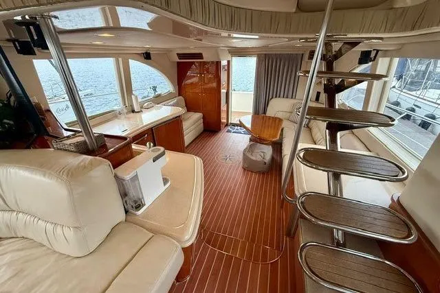  Yacht Photos Pics Luxurious interior of 2001 Sea Ray 540 Cockpit Motor Yacht with elegant wood flooring.