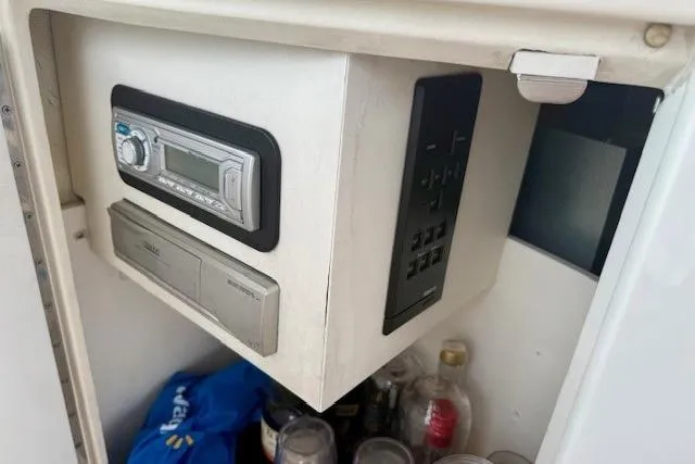  Yacht Photos Pics 2001 Sea Ray 540 Cockpit Motor Yacht interior with stereo system and storage compartment.