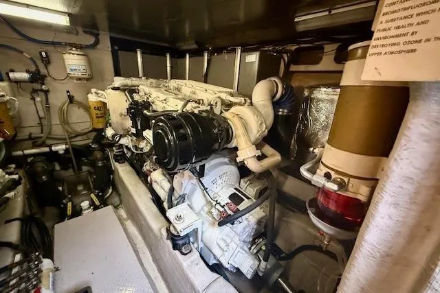  Yacht Photos Pics Engine room of 2001 Sea Ray 540 Cockpit Motor Yacht, showcasing mechanical components and systems.