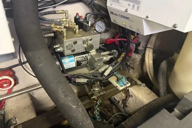  Yacht Photos Pics Engine compartment of 2001 Sea Ray 540 Cockpit Motor Yacht, showing mechanical components and wiring.