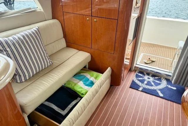  Yacht Photos Pics Interior of 2001 Sea Ray 540 Cockpit Motor Yacht with sofa, storage, and nautical decor.