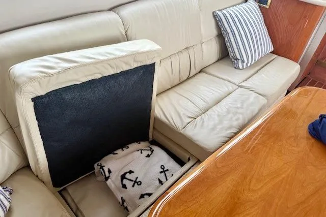  Yacht Photos Pics 2001 Sea Ray 540 Cockpit Motor Yacht interior with cream leather seating and nautical-themed blanket.