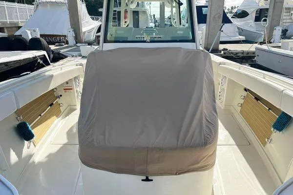 Gyn Tonic Yacht Photos Pics 2018 Hydra-Sports 3000 CC boat interior with covered console, docked at marina.