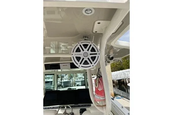 Gyn Tonic Yacht Photos Pics 2018 Hydra-Sports 3000 CC boat interior with speaker and navigation equipment.