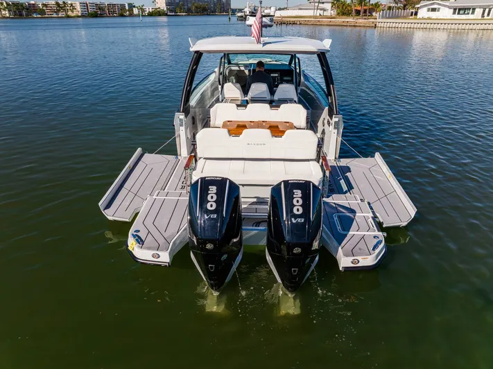  Yacht Photos Pics 2024 Saxdor 320 GTO boat with dual Mercury 300 V8 engines on calm water.