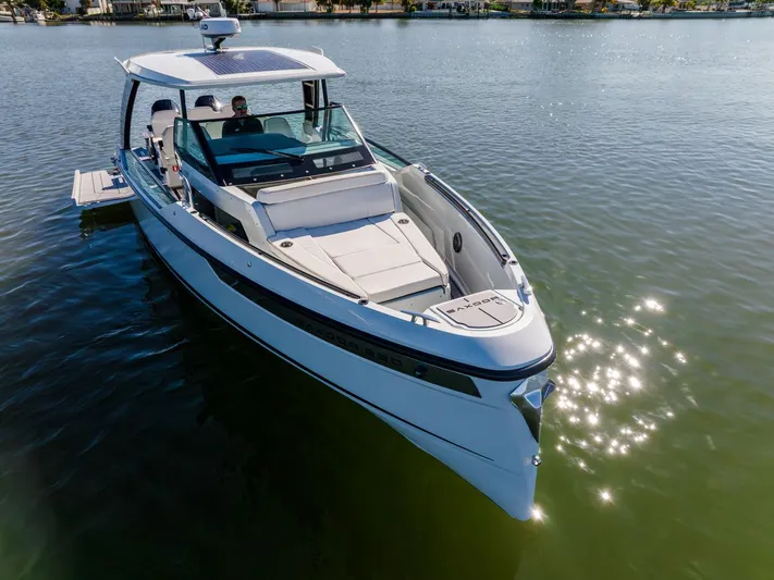  Yacht Photos Pics 2024 Saxdor 320 GTO boat on calm water, showcasing sleek design and luxury features.