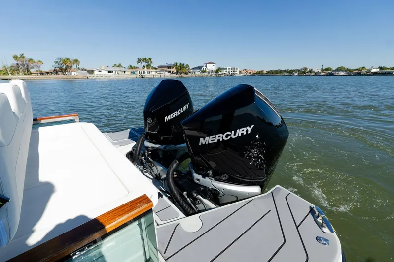  Yacht Photos Pics 2024 Saxdor 320 GTO with dual Mercury outboard engines on a sunny day.