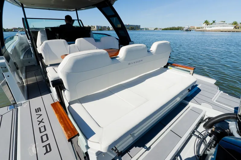  Yacht Photos Pics 2024 Saxdor 320 GTO luxury boat interior with white seating on a sunny day.