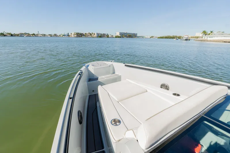  Yacht Photos Pics 2024 Saxdor 320 GTO boat on calm water, featuring sleek design and comfortable seating.