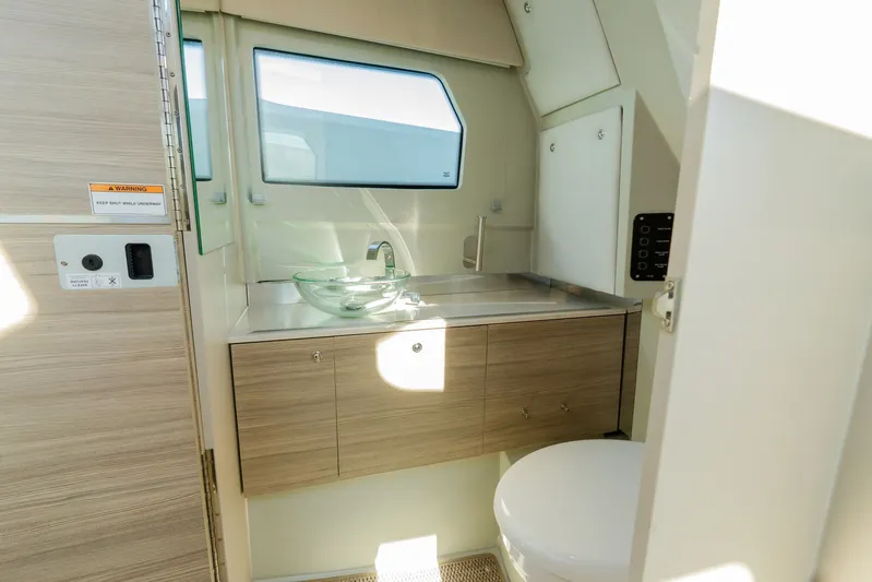  Yacht Photos Pics 2024 Saxdor 320 GTO bathroom with modern sink and wooden cabinetry.