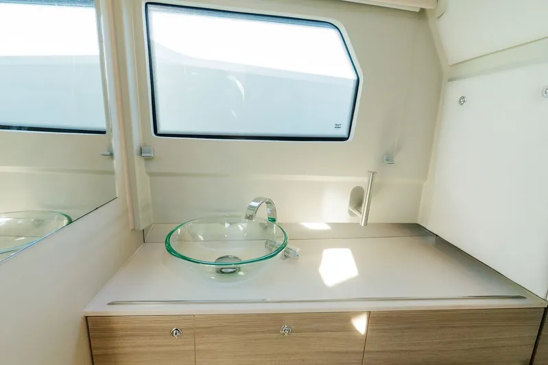  Yacht Photos Pics 2024 Saxdor 320 GTO interior with modern glass sink and sleek cabinetry.