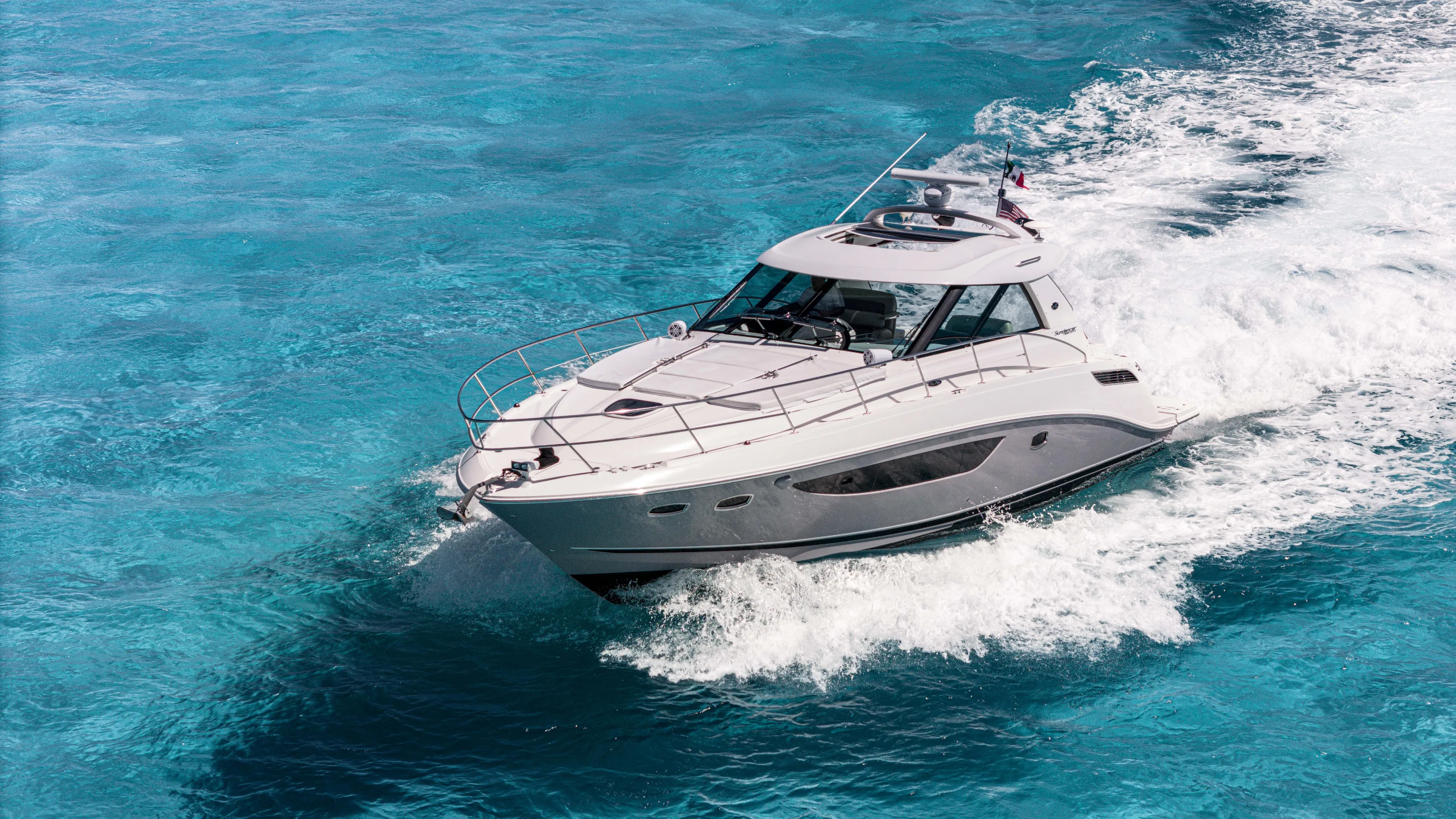 Atm 2013 Sea Ray 450 Sundancer @ Cancun Yacht Photos Pics 2013 Sea Ray 450 Sundancer cruising on clear blue ocean waters.