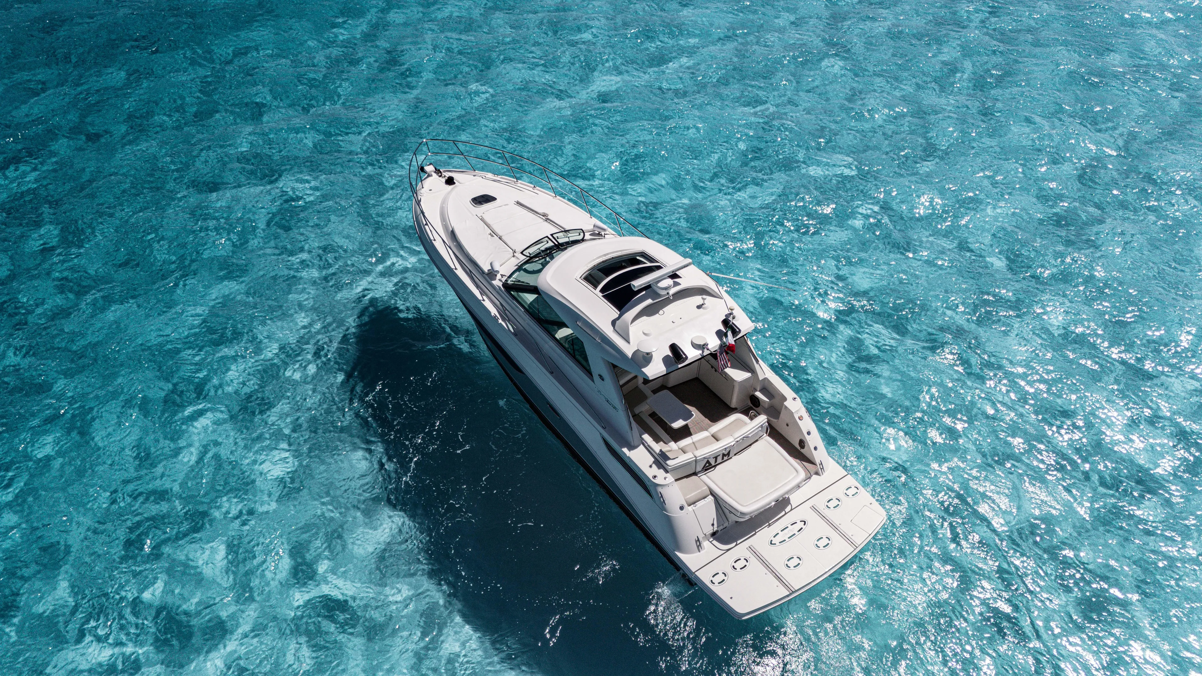 Atm 2013 Sea Ray 450 Sundancer @ Cancun Yacht Photos Pics Sea Ray 450 Sundancer 2013 yacht cruising on clear blue water.