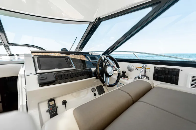 Atm 2013 Sea Ray 450 Sundancer @ Cancun Yacht Photos Pics Helm of 2013 Sea Ray 450 Sundancer yacht with modern controls and steering wheel.