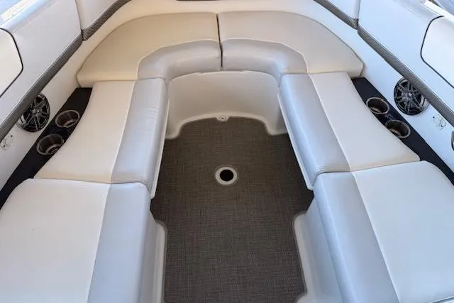  Yacht Photos Pics 2019 Formula 310 Bowrider I/O interior with white cushioned seating and cup holders.