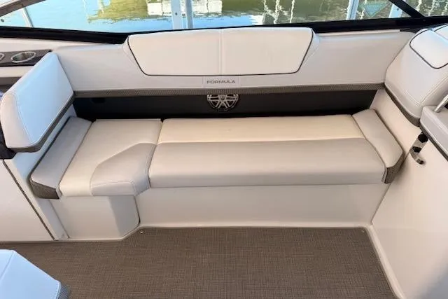  Yacht Photos Pics 2019 Formula 310 Bowrider I/O interior seating with white upholstery and sleek design.