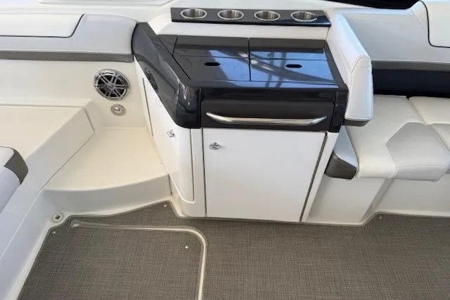  Yacht Photos Pics 2019 Formula 310 Bowrider I/O interior with sleek seating and storage area.