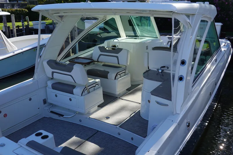  Yacht Photos Pics 2019 World Cat 320 DC boat interior with seating and helm station.