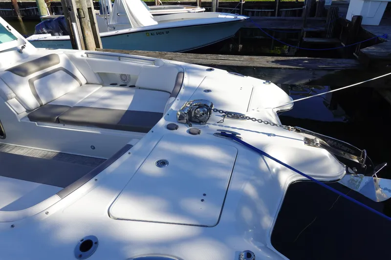  Yacht Photos Pics 2019 World Cat 320 DC boat docked, featuring spacious seating and anchor chain.