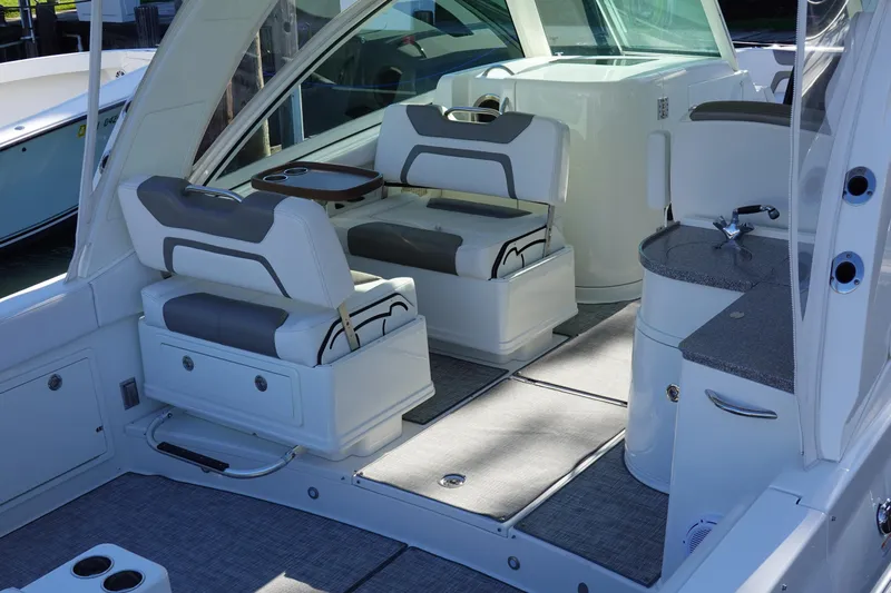  Yacht Photos Pics 2019 World Cat 320 DC boat interior with cushioned seating and modern design.