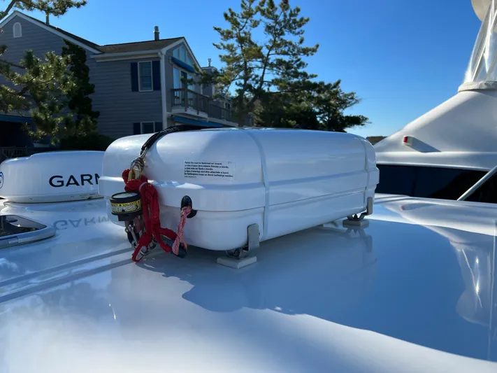  Yacht Photos Pics 2019 World Cat 320 DC boat with a white life raft on deck.