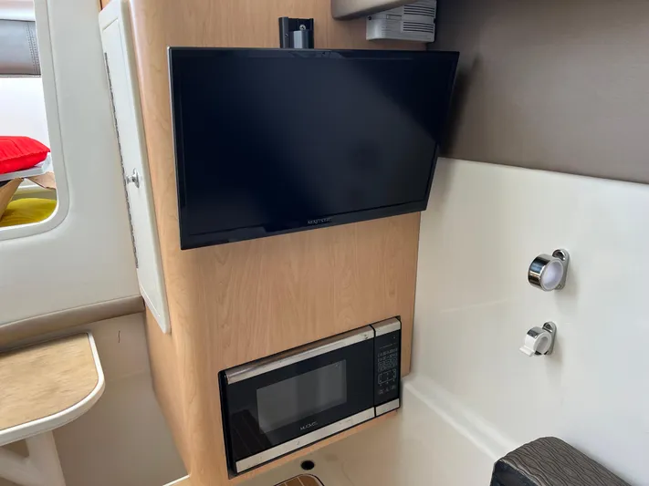  Yacht Photos Pics 2019 World Cat 320 DC interior with TV and microwave in cabin.