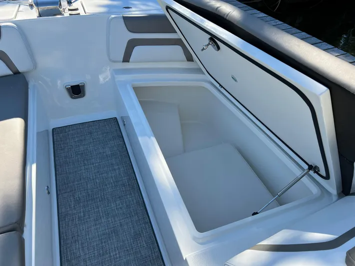  Yacht Photos Pics Open storage compartment on 2019 World Cat 320 DC boat, featuring sleek interior design.