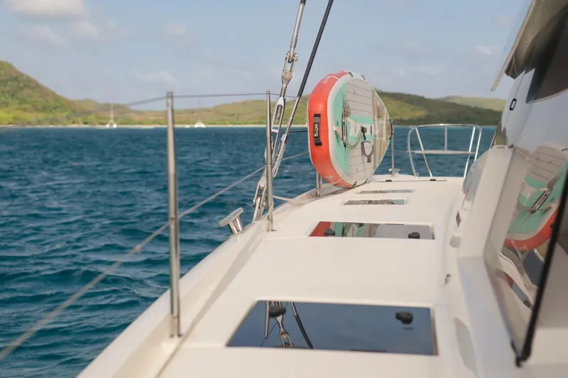 Beyond Yacht Photos Pics 2022 Fountaine Pajot Aura 51 yacht deck with ocean and island view.