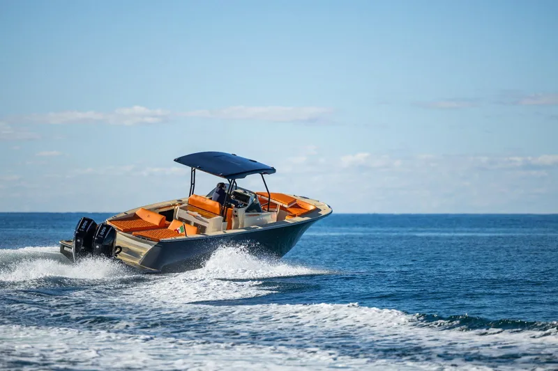  Yacht Photos Pics 2025 AlCustom LIPARI 31 boat cruising on open sea under clear blue sky.
