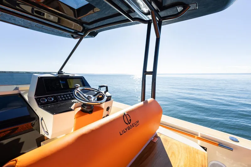  Yacht Photos Pics Modern AlCustom LIPARI 31 boat interior with steering wheel, overlooking calm sea, 2025 model.