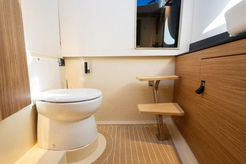  Yacht Photos Pics Modern bathroom interior in AlCustom LIPARI 31 yacht, 2025 model, featuring wood accents and sleek design.