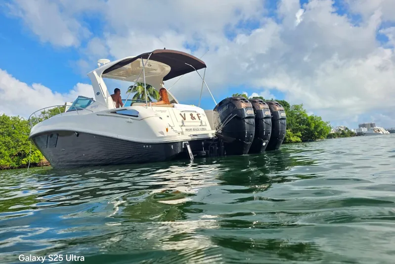3 Mercury 400 Outboards Yacht Photos Pics 2010 Sea Ray 370 Sundancer boat on water, featuring multiple outboard engines.