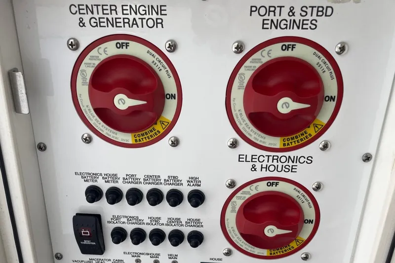  Yacht Photos Pics Control panel of a 2021 Pursuit OS 385 Offshore boat with engine and electronics switches.