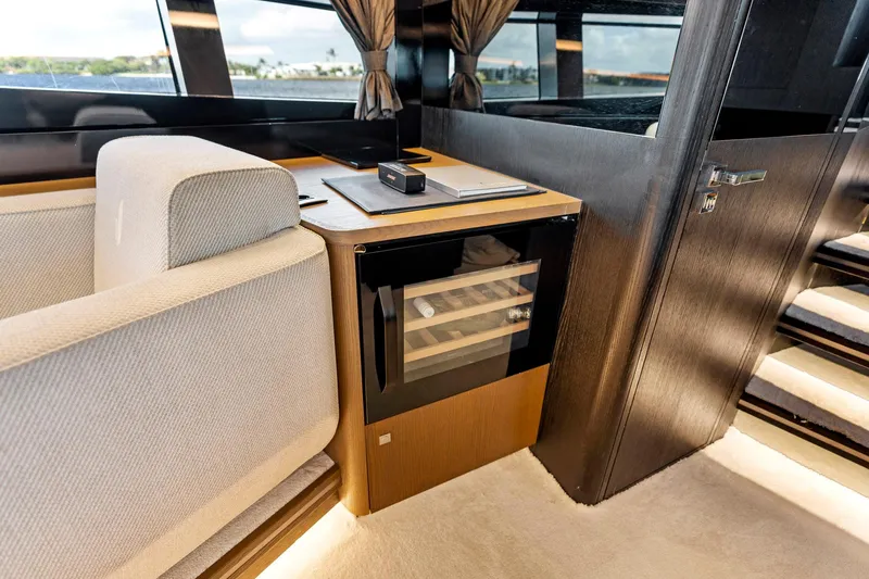 Libertas One Yacht Photos Pics Luxurious interior of 2021 Sichterman Libertas 54 yacht with mini fridge and seating area.
