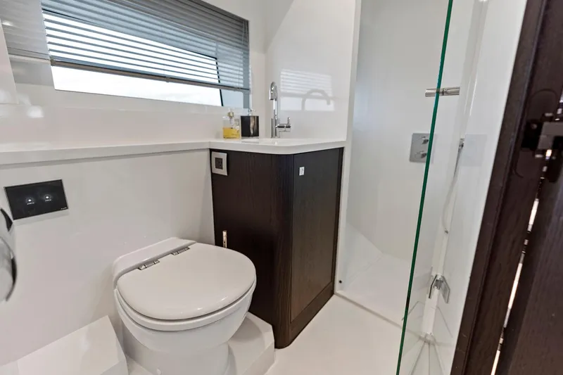 Libertas One Yacht Photos Pics Luxurious bathroom in 2021 Sichterman Libertas 54 yacht with modern fixtures and glass shower.