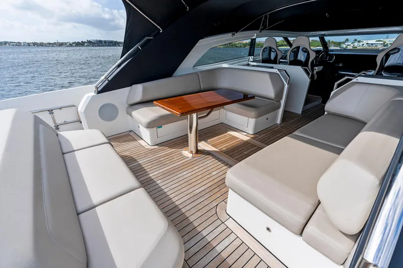Libertas One Yacht Photos Pics Luxurious 2021 Sichterman Libertas 54 yacht interior with elegant seating and wooden table.