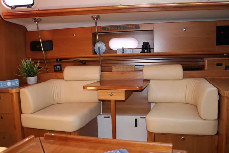 Hannah Yacht Photos Pics Luxurious interior of 2011 Catalina 445 yacht with beige seating and wooden accents.