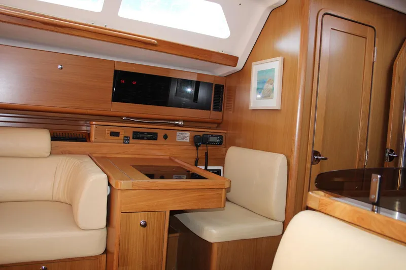 Hannah Yacht Photos Pics Luxurious interior of 2011 Catalina 445 yacht with wood finish and comfortable seating.