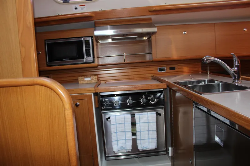 Hannah Yacht Photos Pics 2011 Catalina 445 yacht kitchen with microwave, oven, and stainless steel sink.
