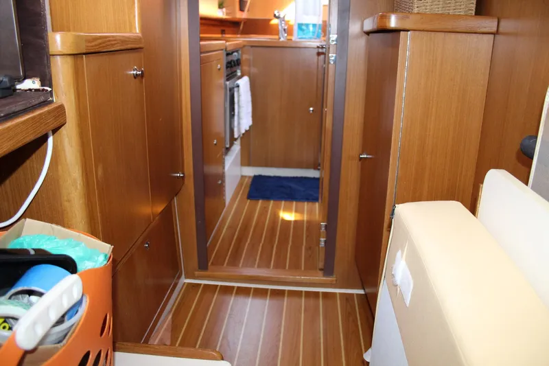Hannah Yacht Photos Pics Interior of 2011 Catalina 445 sailboat with wooden cabinetry and flooring.