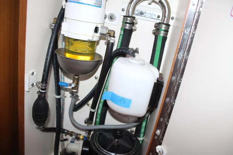 Hannah Yacht Photos Pics Engine compartment of a 2011 Catalina 445 sailboat, showing fuel and fluid systems.