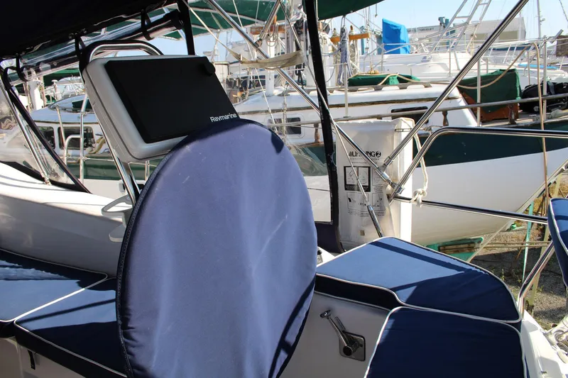 Hannah Yacht Photos Pics 2011 Catalina 445 sailboat cockpit with blue cushions and Raymarine navigation system.