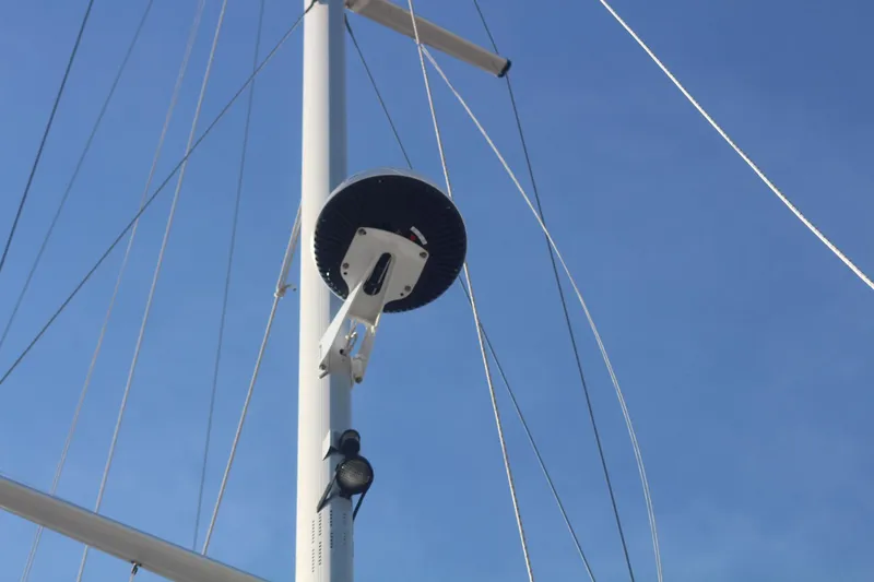 Hannah Yacht Photos Pics Mast of 2011 Catalina 445 sailboat with radar and rigging against blue sky.