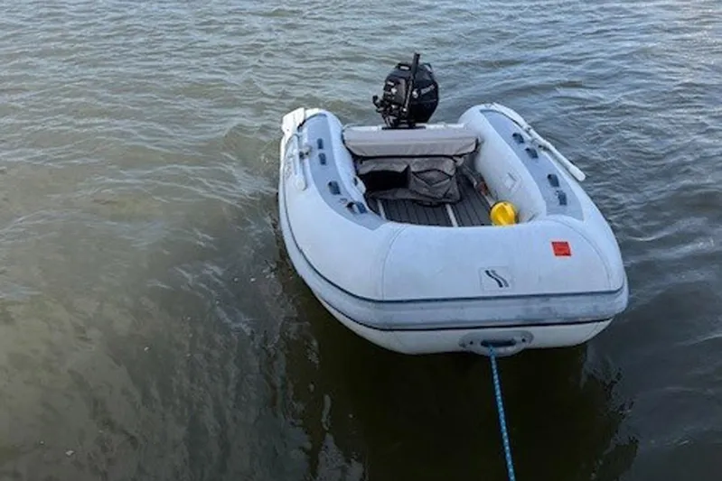 Hannah Yacht Photos Pics Inflatable dinghy with motor on water, Catalina 445, 2011 model.