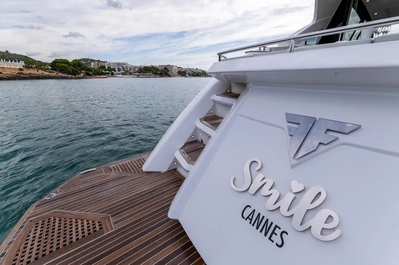  Yacht Photos Pics Luxury Filippetti S55 yacht in Cannes, 2020 model, docked by scenic coastline.