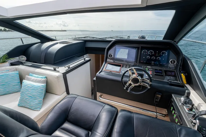  Yacht Photos Pics Luxurious 2020 Filippetti S55S yacht cockpit with modern navigation controls and plush seating.