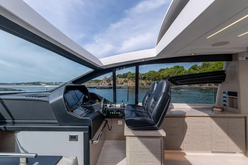  Yacht Photos Pics Interior view of 2020 Filippetti S55S yacht with sleek design and ocean backdrop.