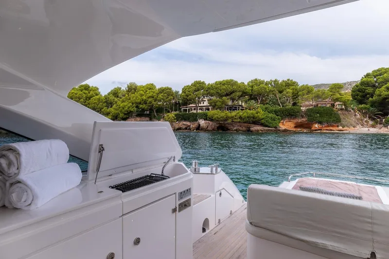  Yacht Photos Pics Luxurious 2020 Filippetti S55S yacht with scenic coastal view and onboard amenities.