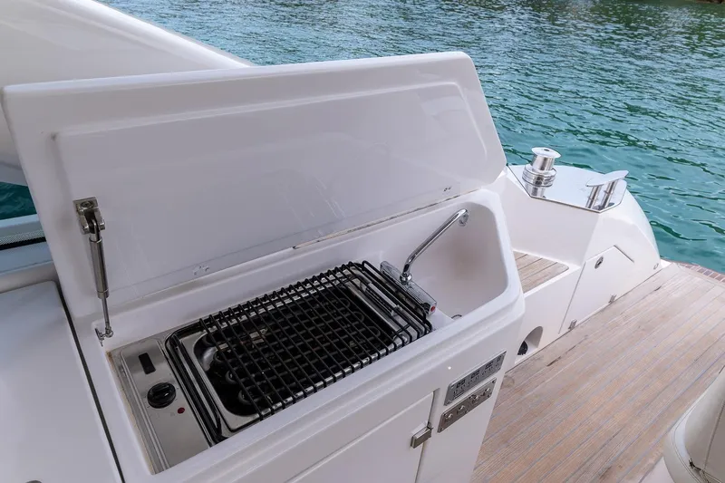  Yacht Photos Pics Outdoor kitchen on 2020 Filippetti S55S yacht with grill and sink by the water.