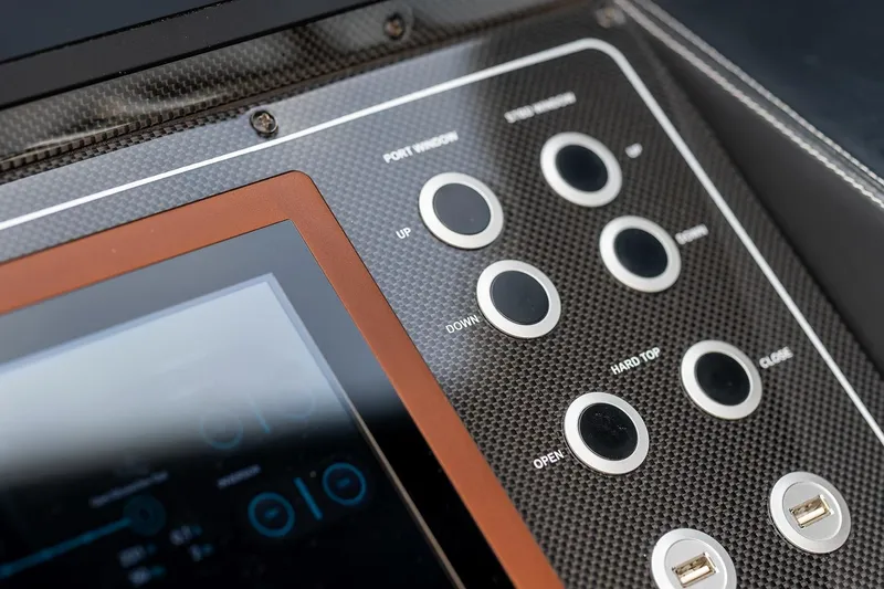  Yacht Photos Pics Control panel of 2020 Filippetti S55S yacht with carbon fiber finish and touchscreen display.